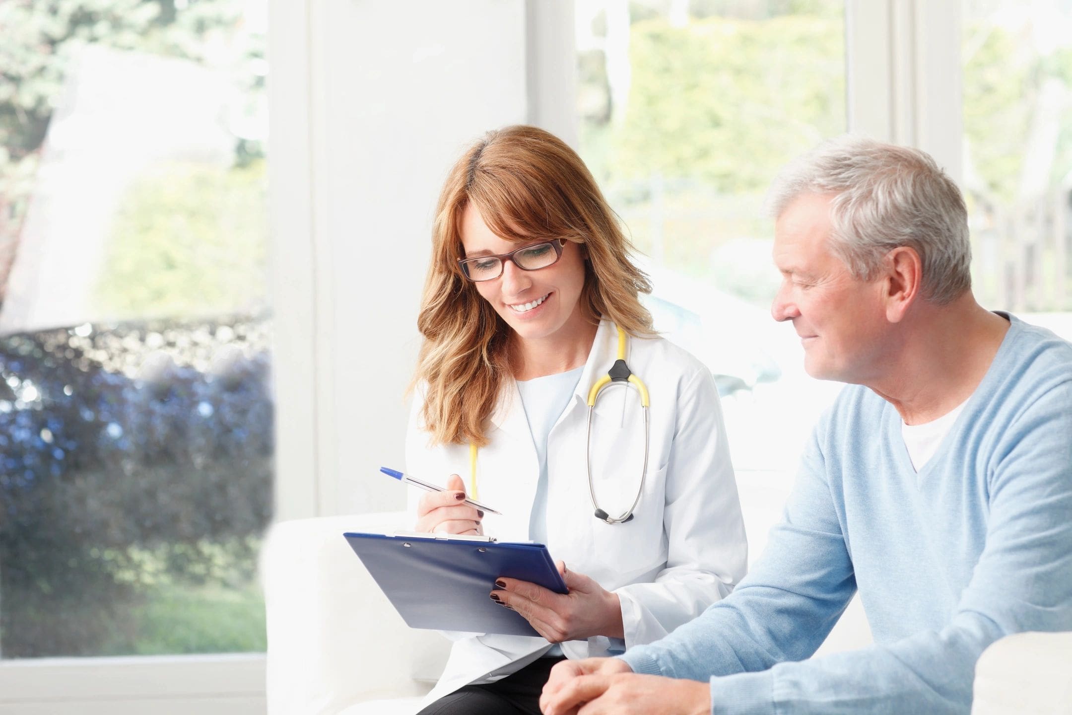 A doctor and patient in an office setting.